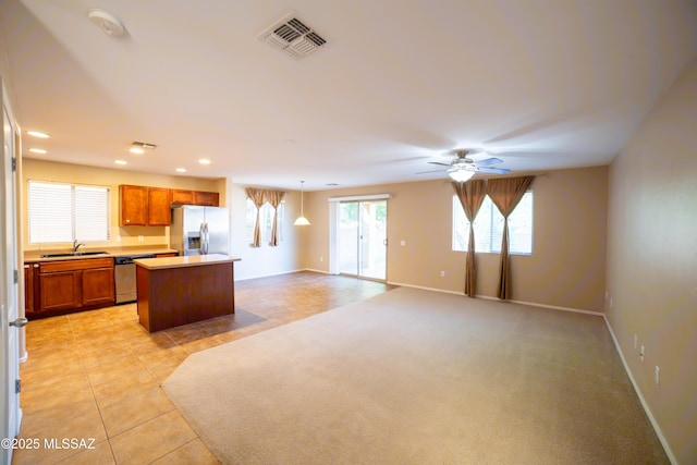 14333 S Camino Vallado, Sahuarita, AZ 85629 - kitchen featuring stainless steel appliances, a sink, a center island, light countertops, and recessed lighting