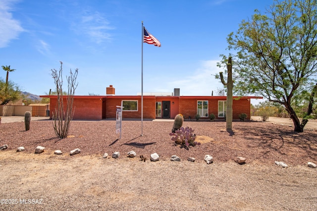 2831 W Puccini Pl, Tucson, AZ 85741 - single story home featuring a chimney and brick siding