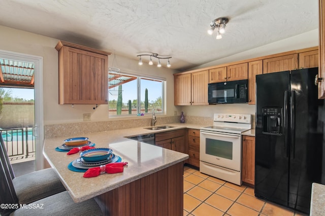 2831 W Puccini Pl, Tucson, AZ 85741 - kitchen with black appliances, a sink, a peninsula, light countertops, and a textured ceiling