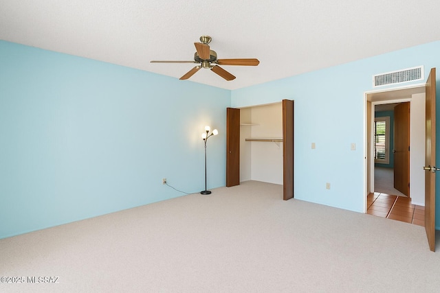 2831 W Puccini Pl, Tucson, AZ 85741 - unfurnished bedroom featuring carpet floors, a closet, and ceiling fan