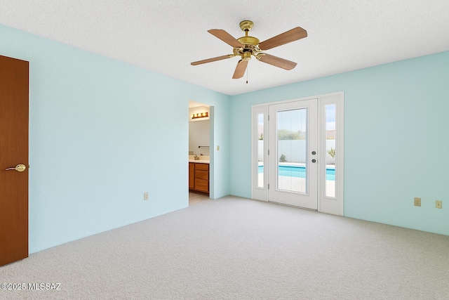2831 W Puccini Pl, Tucson, AZ 85741 - spare room featuring light carpet and a ceiling fan