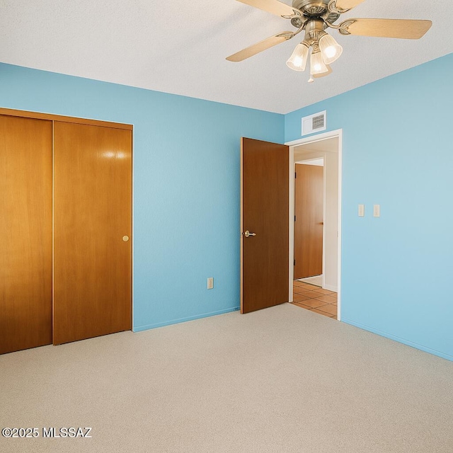 2831 W Puccini Pl, Tucson, AZ 85741 - unfurnished bedroom featuring carpet, a closet, ceiling fan, and baseboards