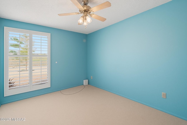 2831 W Puccini Pl, Tucson, AZ 85741 - empty room featuring carpet floors, baseboards, a textured ceiling, and ceiling fan