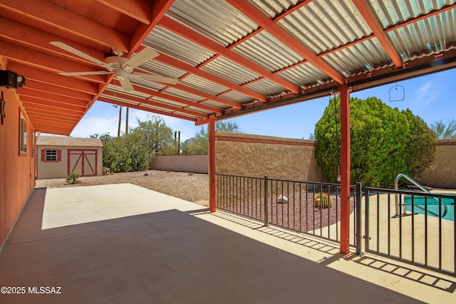 2831 W Puccini Pl, Tucson, AZ 85741 - view of patio / terrace with a storage shed, a fenced backyard, an outdoor structure, and a ceiling fan