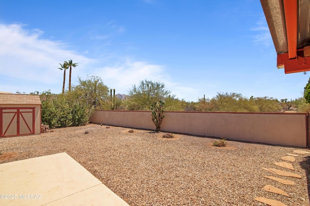 2831 W Puccini Pl, Tucson, AZ 85741 - view of yard featuring a storage shed, fence, an outdoor structure, and a patio