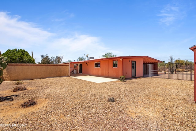 2831 W Puccini Pl, Tucson, AZ 85741 - rear view of house with fence and a patio area