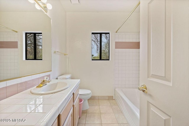 11126 N Guava Dr, Oro Valley, AZ 85737 - full bathroom with tile patterned floors, vanity, toilet, and shower / tub combination
