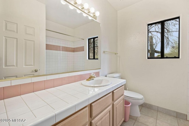 11126 N Guava Dr, Oro Valley, AZ 85737 - full bathroom featuring tile patterned flooring, toilet, a shower, vanity, and baseboards