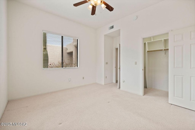 11126 N Guava Dr, Oro Valley, AZ 85737 - unfurnished bedroom with light colored carpet, ceiling fan, and baseboards