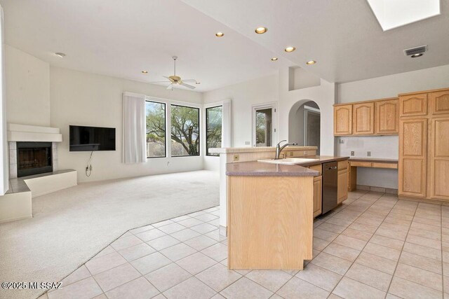 11126 N Guava Dr, Oro Valley, AZ 85737 - kitchen featuring a sink, light colored carpet, recessed lighting, dishwasher, and arched walkways
