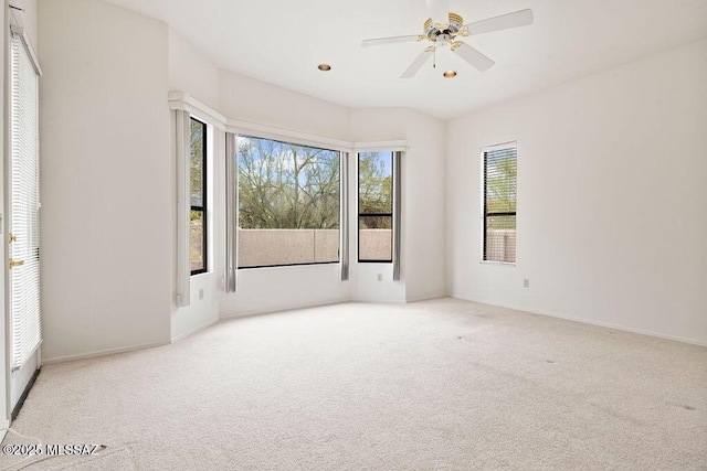 11126 N Guava Dr, Oro Valley, AZ 85737 - empty room featuring carpet flooring, plenty of natural light, and ceiling fan