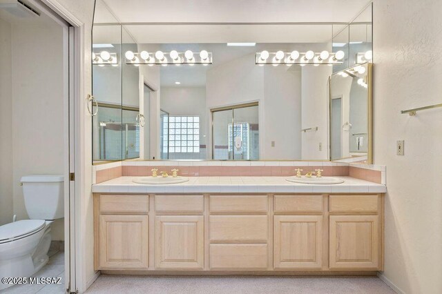 11126 N Guava Dr, Oro Valley, AZ 85737 - bathroom featuring toilet and double vanity