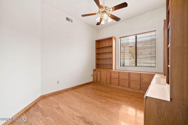 11126 N Guava Dr, Oro Valley, AZ 85737 - empty room with light wood-style floors, ceiling fan, and baseboards