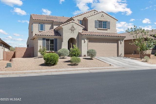 7809 S Land Grant Dr, Tucson, AZ 85747 - mediterranean / spanish house featuring stucco siding, driveway, a tile roof, and an attached garage