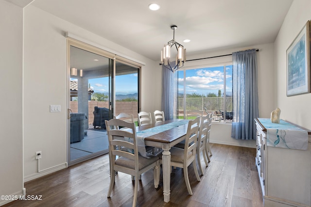 7809 S Land Grant Dr, Tucson, AZ 85747 - dining room featuring a chandelier, wood finished floors, recessed lighting, and baseboards