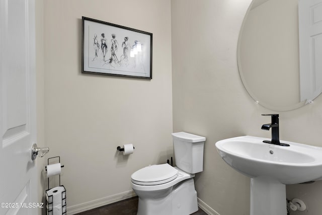 7809 S Land Grant Dr, Tucson, AZ 85747 - half bath featuring toilet and baseboards