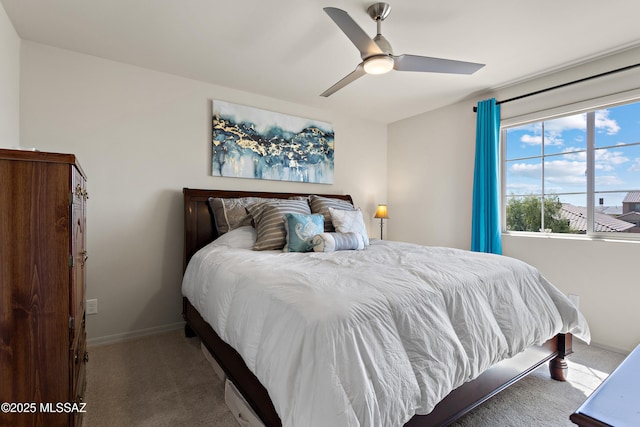 7809 S Land Grant Dr, Tucson, AZ 85747 - bedroom with carpet flooring, baseboards, and ceiling fan