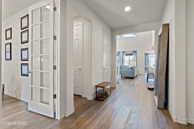 7809 S Land Grant Dr, Tucson, AZ 85747 - corridor featuring wood finished floors, baseboards, and recessed lighting