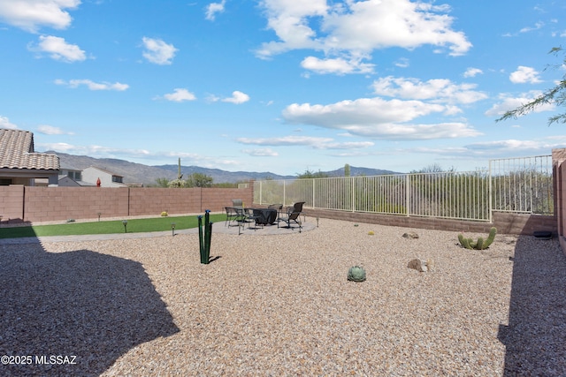7809 S Land Grant Dr, Tucson, AZ 85747 - view of jungle gym featuring a fenced backyard, a mountain view, and a patio area