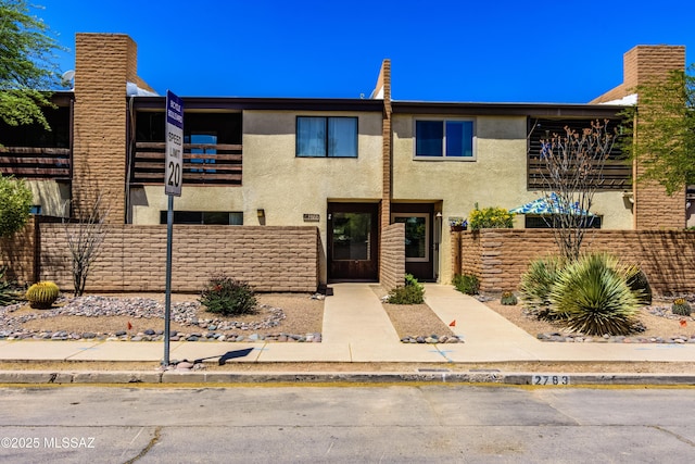 2777 N Treat Ave, Tucson, AZ 85716 - view of front of property featuring stucco siding, fence, and a balcony