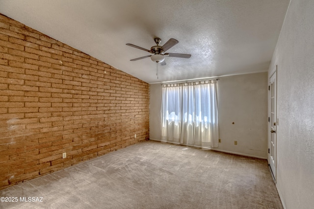 2777 N Treat Ave, Tucson, AZ 85716 - carpeted empty room featuring ceiling fan, brick wall, and baseboards