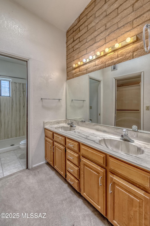 2777 N Treat Ave, Tucson, AZ 85716 - bathroom with a shower, double vanity, and toilet