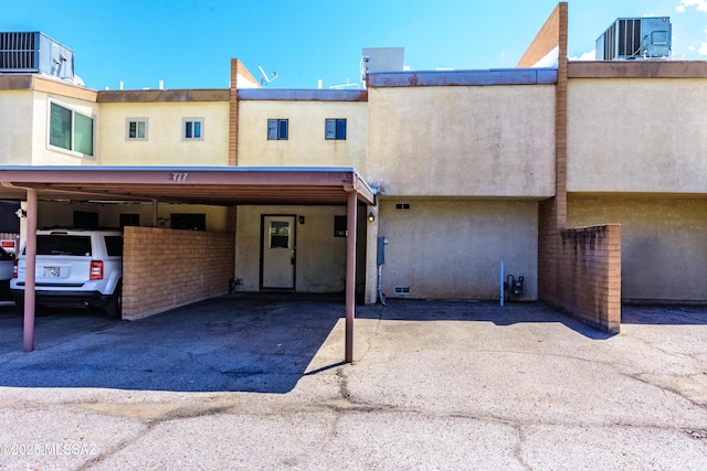 2777 N Treat Ave, Tucson, AZ 85716 - view of property with stucco siding, central AC, and covered parking