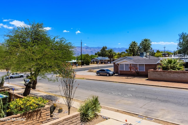 2777 N Treat Ave, Tucson, AZ 85716 - view of asphalt street featuring sidewalks and a mountain view