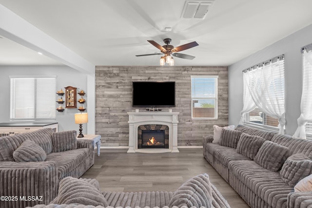 17303 S Nicholas Falls Dr, Vail, AZ 85641 - living room with ceiling fan, a large fireplace, and light wood-style floors