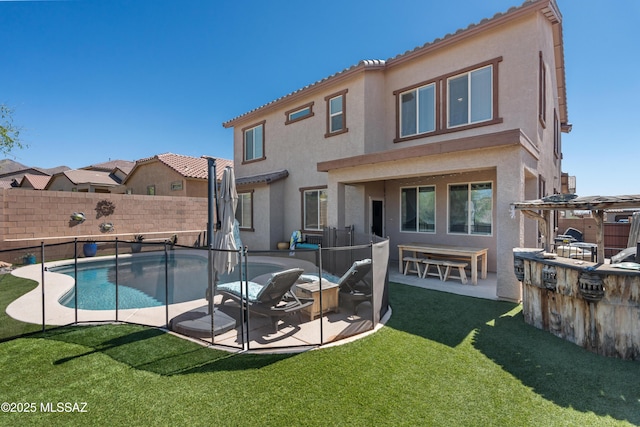 17303 S Nicholas Falls Dr, Vail, AZ 85641 - back of property featuring stucco siding, a patio area, a pergola, and an outdoor kitchen