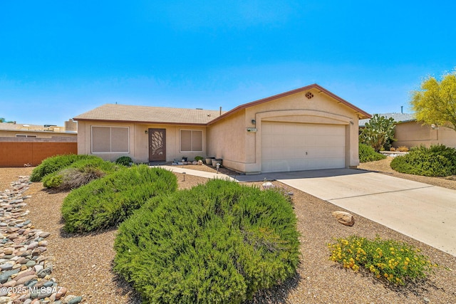 8892 E Apache Well Pl, Tucson, AZ 85730 - single story home featuring an attached garage, concrete driveway, fence, and stucco siding