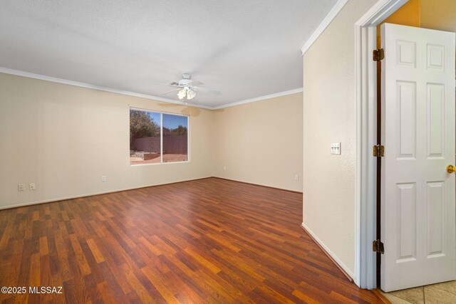 8892 E Apache Well Pl, Tucson, AZ 85730 - spare room with ceiling fan, wood finished floors, and ornamental molding