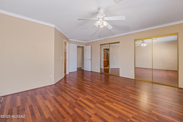 8892 E Apache Well Pl, Tucson, AZ 85730 - unfurnished bedroom with two closets, wood finished floors, ornamental molding, a ceiling fan, and baseboards