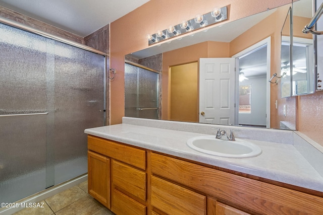 8892 E Apache Well Pl, Tucson, AZ 85730 - full bathroom with a stall shower, tile patterned floors, and vanity
