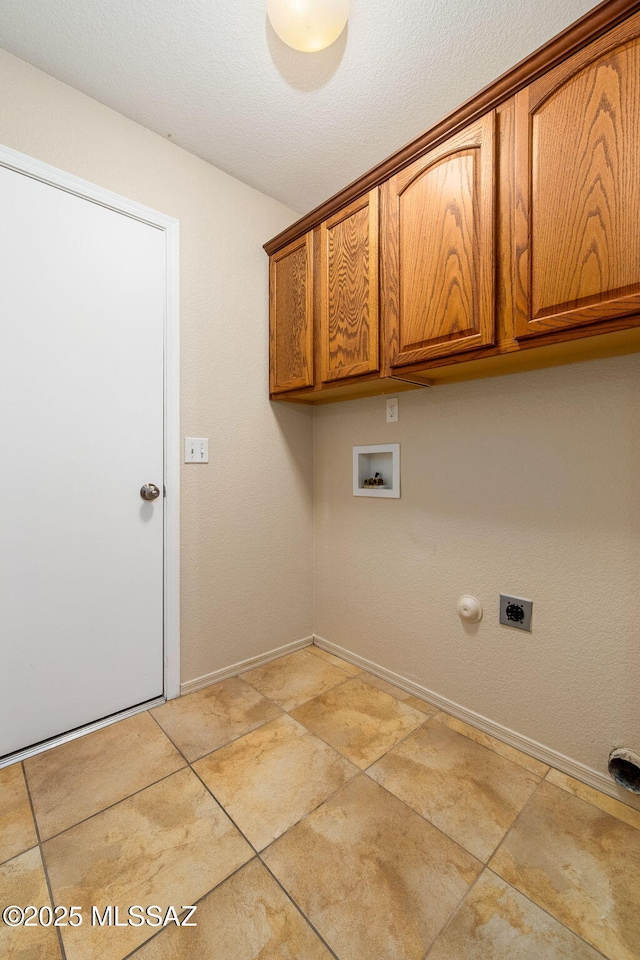 8892 E Apache Well Pl, Tucson, AZ 85730 - laundry room with cabinet space, hookup for a washing machine, hookup for an electric dryer, hookup for a gas dryer, and baseboards