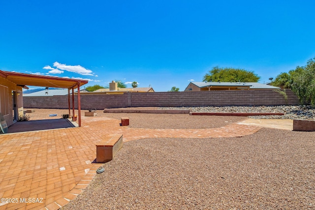 8892 E Apache Well Pl, Tucson, AZ 85730 - fenced backyard with a patio