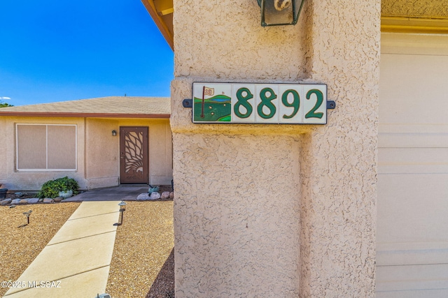 8892 E Apache Well Pl, Tucson, AZ 85730 - view of exterior entry featuring stucco siding