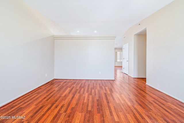 8892 E Apache Well Pl, Tucson, AZ 85730 - unfurnished room with wood finished floors, recessed lighting, and baseboards