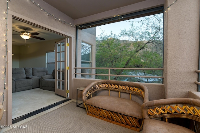 sunroom / solarium featuring french doors