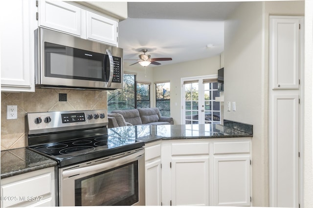 kitchen featuring appliances with stainless steel finishes, a ceiling fan, white cabinets, and french doors