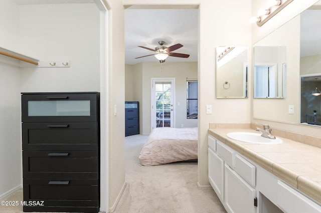 bathroom featuring a ceiling fan, vanity, and ensuite bathroom