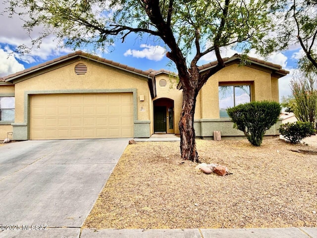 13704 E Via Valle De Lobo, Vail, AZ 85641 - view of front of property with a garage, concrete driveway, and stucco siding