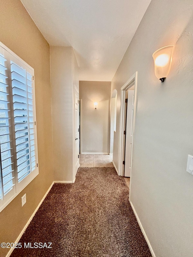 13704 E Via Valle De Lobo, Vail, AZ 85641 - corridor featuring carpet flooring, baseboards, and arched walkways