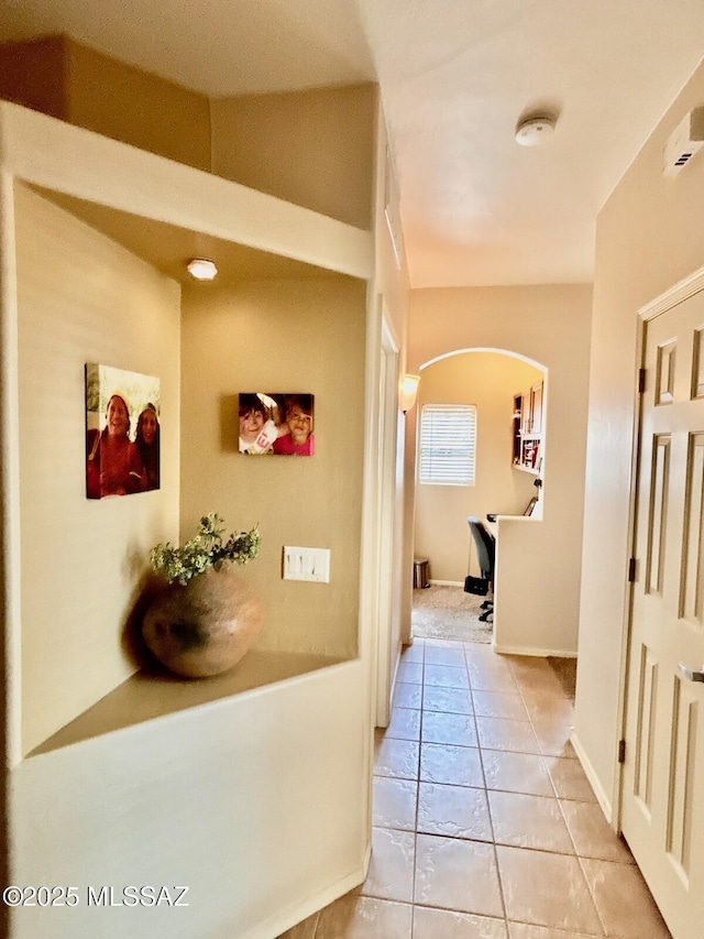 13704 E Via Valle De Lobo, Vail, AZ 85641 - hallway with arched walkways, light tile patterned flooring, and baseboards