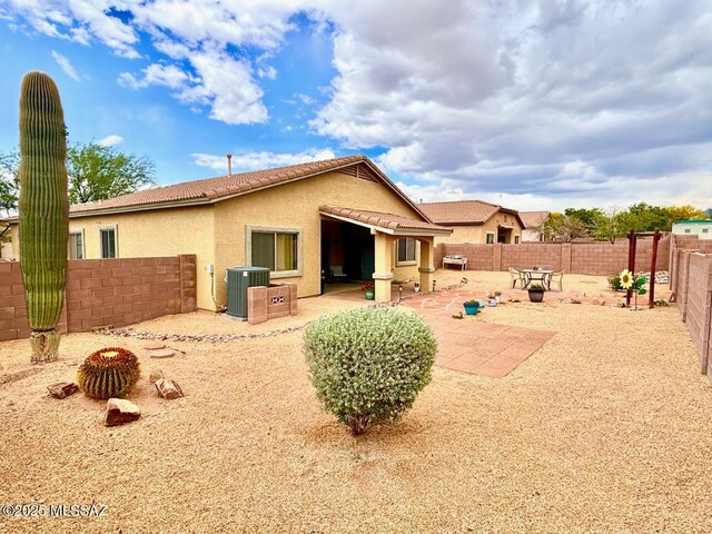 13704 E Via Valle De Lobo, Vail, AZ 85641 - rear view of property with central AC unit, stucco siding, a patio, a fenced backyard, and a tiled roof