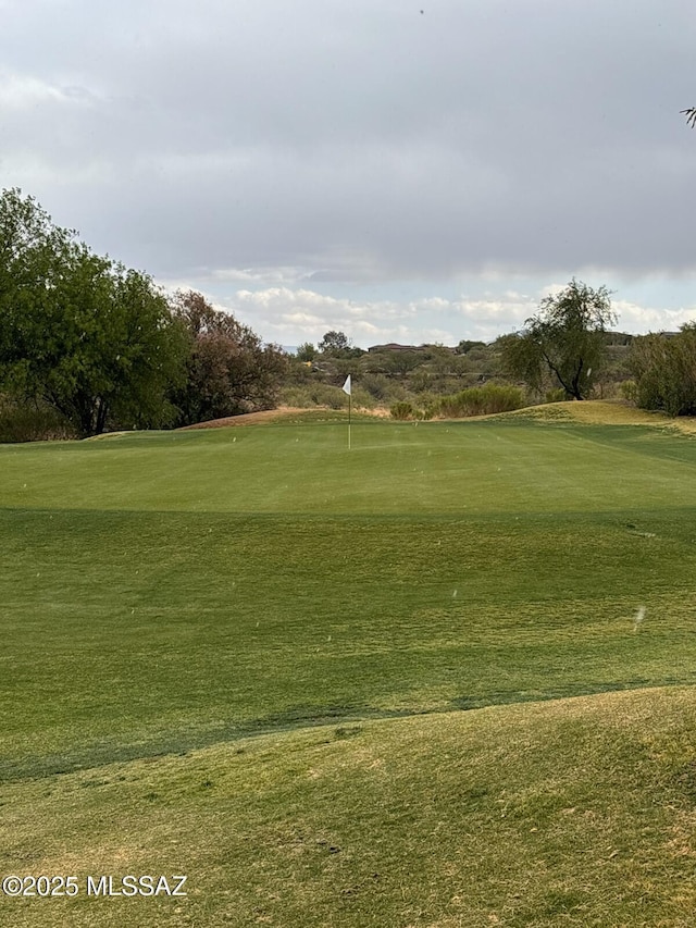 13704 E Via Valle De Lobo, Vail, AZ 85641 - view of home's community featuring view of golf course, a putting area, and a lawn