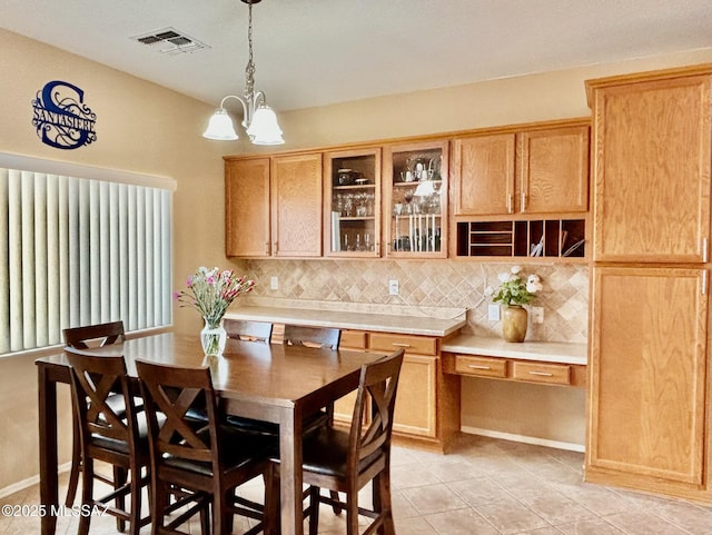 13704 E Via Valle De Lobo, Vail, AZ 85641 - dining room with a chandelier and light tile patterned floors