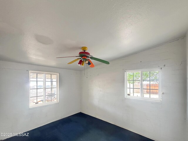 919 W 3rd Ave, San Manuel, AZ 85631 - empty room with a ceiling fan, a textured ceiling, and lofted ceiling