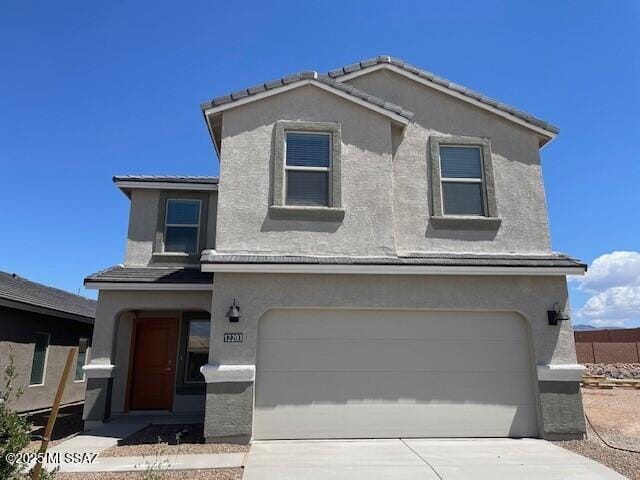 12203 E Patricia Ann Dr, Vail, AZ 85641 - traditional-style house featuring stucco siding, an attached garage, and driveway