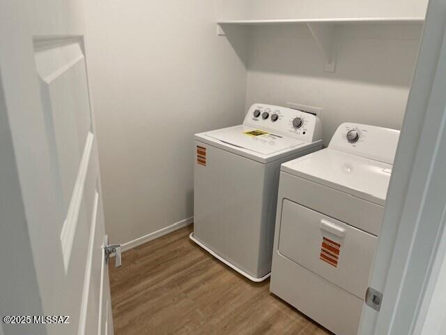 12203 E Patricia Ann Dr, Vail, AZ 85641 - laundry area with washer and dryer and light wood-type flooring